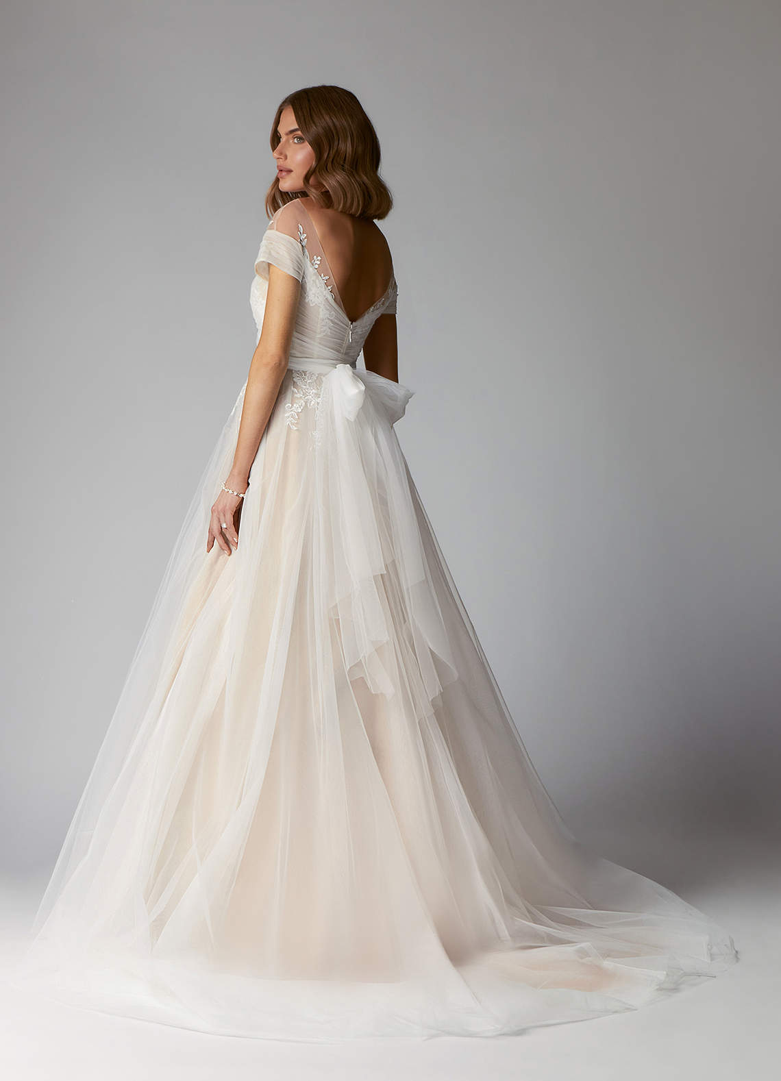 Azazie Cindy Wedding Dresses A-Line Illusion Off-The-Shouler Lace Tulle Chapel Train Dress image1
