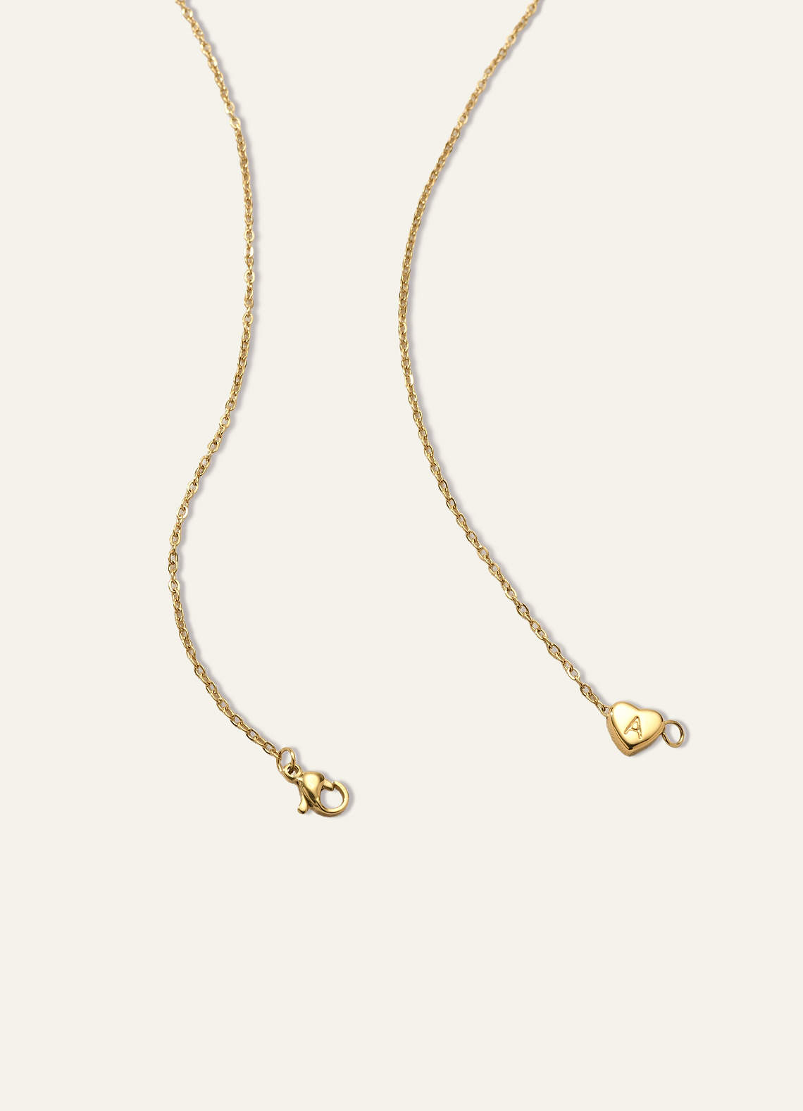 front 18 karaatin kullattu sydämenmuotoinen kirjainkoru