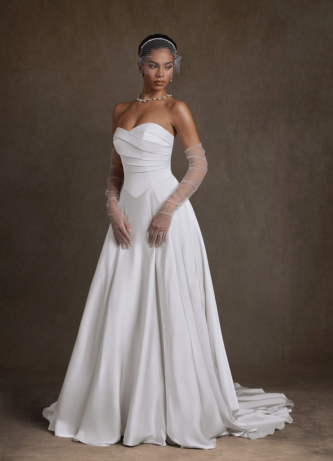 strapless aline dress B243004_Chic Poly Chiffon A-line Gown with Asymmetrical Neckline and Front Slit Skirt while the design of strapless and sleeveless bodice adds a touch of modern sophistication Azazie 2026 A-Line Modern White