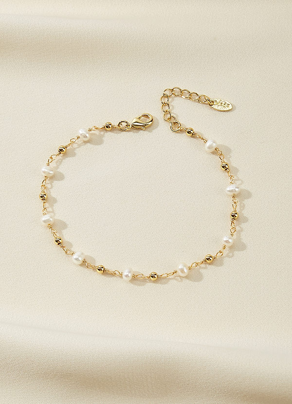 front Pulsera de perlas y cuentas doradas